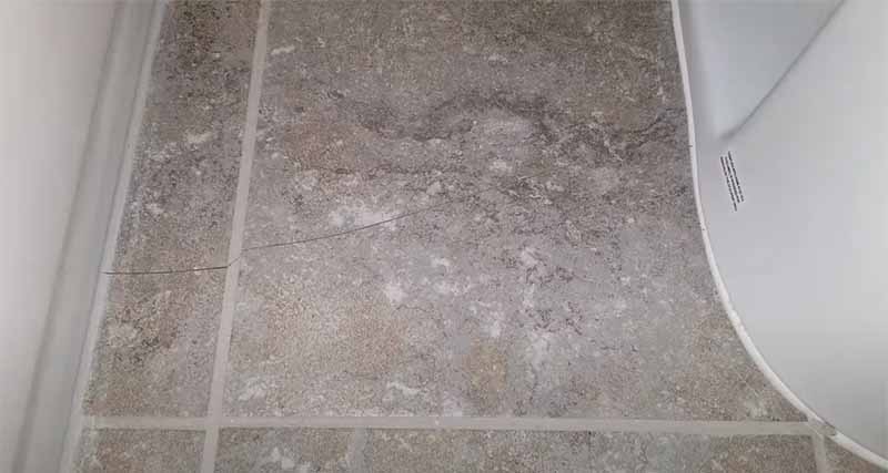 Repair hairline crack in shower tile